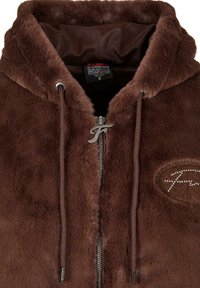 Sweat à capuche marron avec fermeture éclair, en fausse fourrure douce, doté d'une capuche avec cordon de serrage, d'une fermeture éclair argentée et d'un logo brodé orné de strass sur la poitrine.