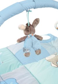Soft baby play gym with hanging brown plush bunny wearing blue overalls above a patchwork blue and green play mat.