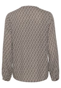 Blusa marrone a maniche lunghe con un motivo geometrico bianco, tessuto leggero, orlo arrotondato e polsini elasticizzati.