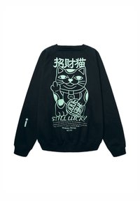 Sweatshirt noir avec un grand graphisme de chat porte-bonheur vert clair et des caractères chinois, arborant la phrase "TOUJOURS CHANCEUX" avec un petit texte en dessous.