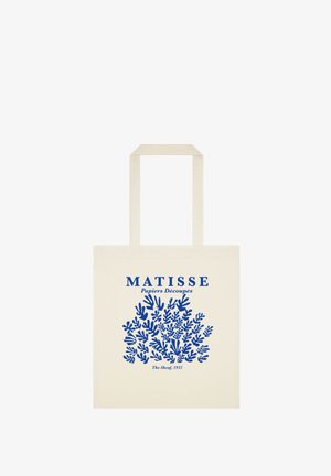 Beżowa torba na ramię z niebieską grafiką abstrakcyjnych liści i napisem „Matisse Papiers Découpés The Sheaf, 1953.”