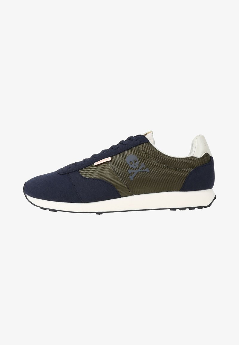 Navy blue suede and olive mesh sneaker with white accents, skull graphic, and flat black rubber sole, designed for casual wear.