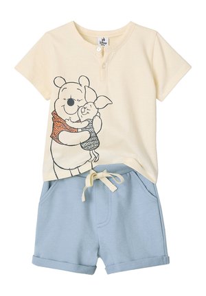 Cream short-sleeve baby shirt with Winnie the Pooh and Piglet hug graphic, paired with light blue drawstring shorts.