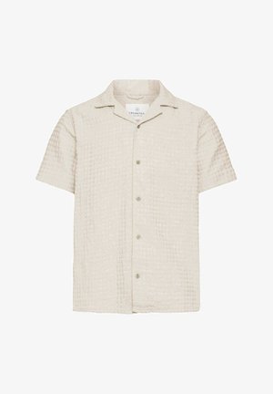 Camicia a maniche corte, con bottoni, di colore beige chiaro, in tessuto testurizzato con motivo a quadri, dotata di colletto a punta e cinque bottoni sulla parte frontale.