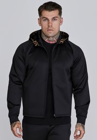 Tröja med dragkedja - black