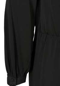 Czarny longsleeve z marszczonym pasem, zapinanymi mankietami i gładkim, teksturowanym materiałem. Skup się na detalach rękawów i pasa.