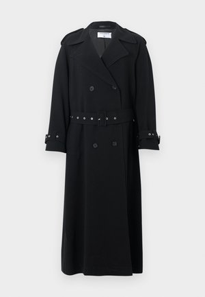 Black long double-breasted trench coat with wide lapels, belted waist, buckle straps on cuffs, and shoulder epaulets.