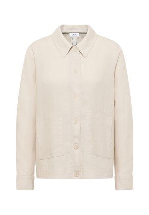 Béžová bunda na knoflíky s špičatým límečkem, dlouhými rukávy, dvěma předními náprsnými kapsami a rovnějším spodním lemem.