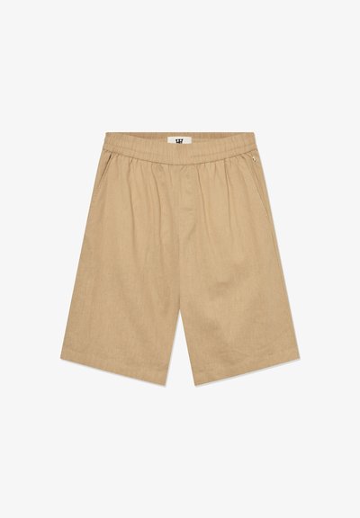 Beige Baumwollshorts mit einem elastischen Bund, zwei Seitentaschen und einer lockeren Passform. Der Stoff hat eine subtile Textur.