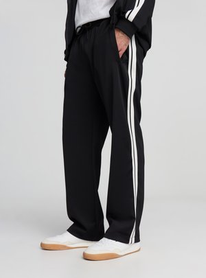 GINNICO LUNGO STAMPE - Pantaloni - nero