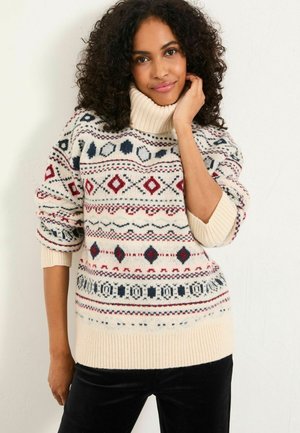 Cremfarbener Strickpullover mit hohem Rippkragen. Mit einem geometrischen Muster in Rot, Blau und Marine. Weiche Textur, lässige Passform.