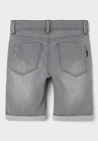 Gray denim shorts with a faded finish, rolled hems, and two back pockets featuring double-stitched accents. Flat waistband with belt loops.