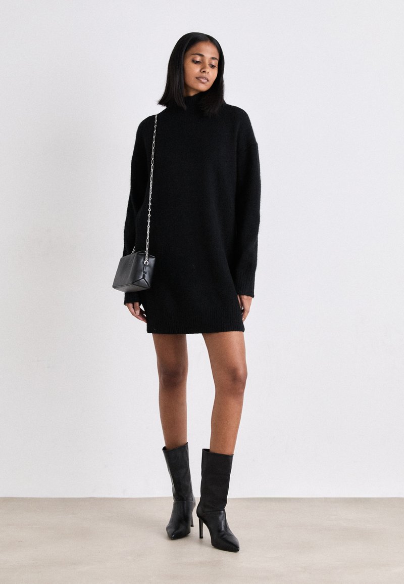 black loose sweater dress Kyler Sweater Dress in Caviar main image 1