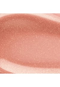 Nahaufnahme einer strukturierten, gesprenkelten Oberfläche in gedämpftem Rosa mit helleren Sprenkeln und glatten, geschwungenen Formen.
