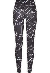 Leggings neri con un motivo geometrico bianco, realizzati in materiale elasticizzato, progettati per adattarsi in modo aderente e confortevole.