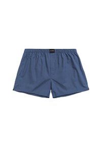 Niebieskie szorty kąpielowe z elastycznym pasem, wykonane z lekkiego materiału. Prosty design bez wzorów i akcentów. Metka z tyłu.