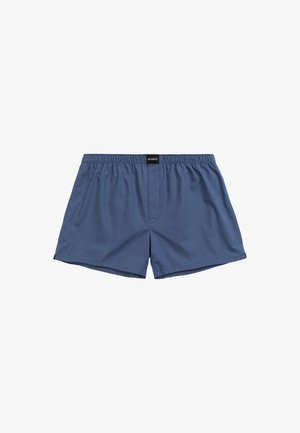 Niebieskie szorty kąpielowe z elastycznym pasem, wykonane z lekkiego materiału. Prosty design bez wzorów i akcentów. Metka z tyłu.