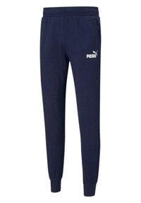 Granatowe spodnie dresowe wykonane z miękkiego materiału, z elastycznym pasem, ściągaczami przy nogawkach oraz białym logo Puma na lewej udzie.