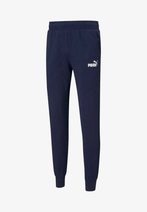Granatowe spodnie dresowe wykonane z miękkiego materiału, z elastycznym pasem, ściągaczami przy nogawkach oraz białym logo Puma na lewej udzie.