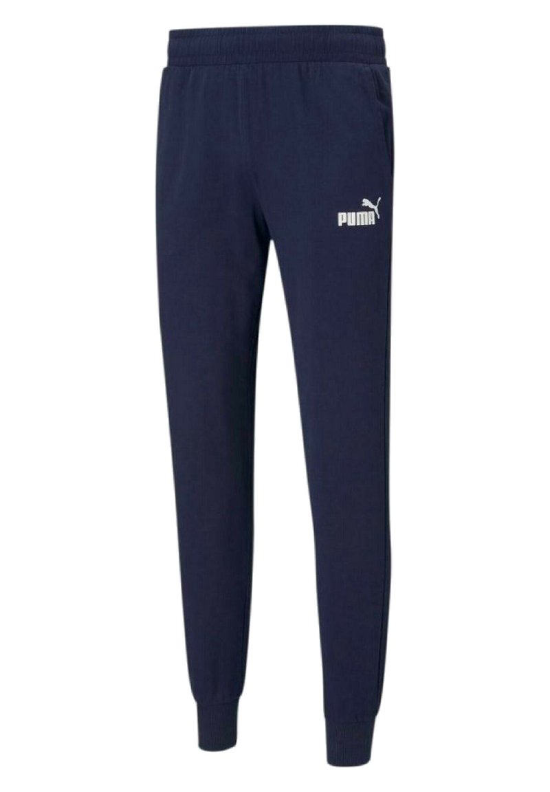 Granatowe spodnie dresowe wykonane z miękkiego materiału, z elastycznym pasem, ściągaczami przy nogawkach oraz białym logo Puma na lewej udzie.