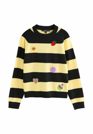 Striped sweater with yellow and black colors, featuring embroidered patches: a strawberry, sunflower, smiley, heart, and cupcake.