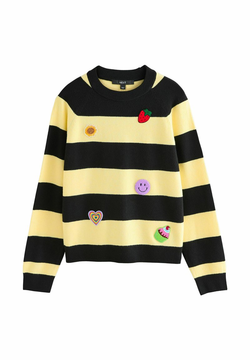Striped sweater with yellow and black colors, featuring embroidered patches: a strawberry, sunflower, smiley, heart, and cupcake.