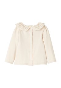 Cremfarbener Baby-Cardigan mit langen Ärmeln, einem Spitzen-Peter-Pan-Kragen und einer Frontknopfverschluss.