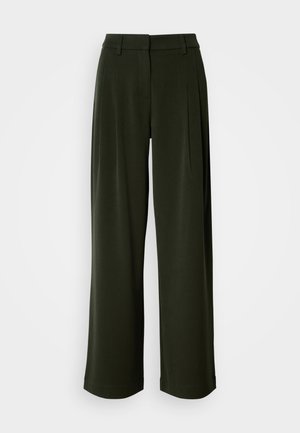 Mørkegrønne brede bukser med bæltestropper, frontfolder og en skjult frontknap og lynlås lukning.