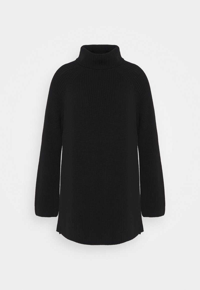 Pull à col roulé noir en maille, manches longues, coupe ample avec un ourlet légèrement évasé sur un fond clair uni.