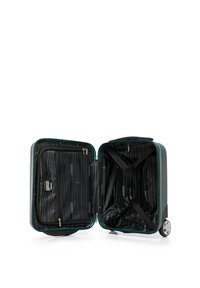 Valise à coque rigide verte de cabine avec un intérieur noir doublé, un compartiment zippé et des sangles croisées pour sécuriser le contenu.