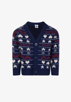 Granatowy sweter z dzianiny z dekoltem w serek, z zapięciem na guziki oraz świątecznymi białymi i czerwonymi wzorami w gwiazdy, serca i zygzaki.