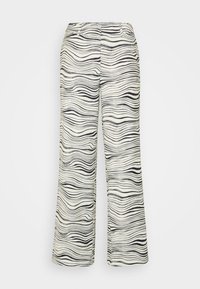Calças largas em tom creme com um padrão ondulado preto. Apresentam dois bolsos frontais e uma textura de tecido leve e suave.