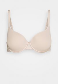 Soutien-gorge rembourré beige avec des bonnets lisses, des bretelles ajustables et une bande inférieure texturée ; se ferme à l'arrière par un crochet et un œil pour un ajustement optimal.