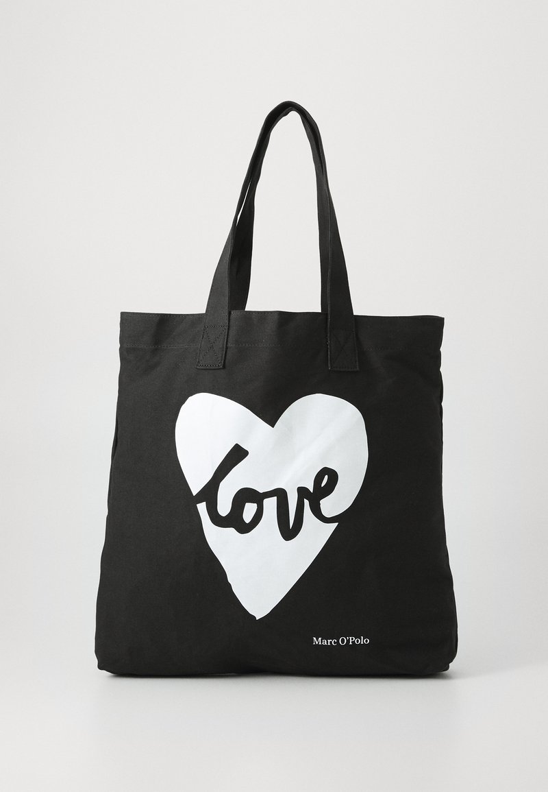 Sac fourre-tout noir en toile, ornée d'un graphique en forme de cœur blanc avec le mot "love" en écriture noire. Design simple avec des poignées robustes.