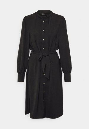 Black long-sleeve midi dress with ruffled neckline, button front, gathered waist, and matching fabric belt tied at the waist.