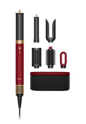 Hårstylingværktøj med seks sorte og røde udskiftelige vedhæftninger og en sort og rød opbevaringsetui.