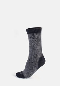 Calcetines de color azul oscuro con un patrón de espiga, de longitud media hasta la pantorrilla, hechos de una tela texturizada, que cuentan con un puño acanalado sólido y un talón reforzado.