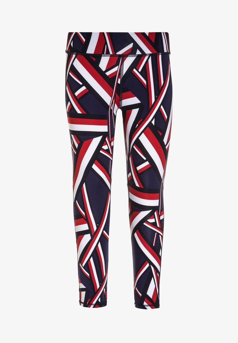 Legíny s vysokým pasem vyrobené z elastického materiálu s námořnickým základem a červenými a bílými abstraktními geometrickými vzory a kontrastním prošitím.