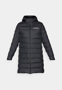 Black long puffer jacket with a hood, featuring a front zipper, horizontal stitching, and a logo on the left chest side. Textured fabric.