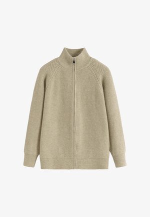 Pull beige en maille avec col montant, fermeture éclair intégrale et texture côtelée. Présente des manches raglan et une coupe décontractée et oversize.