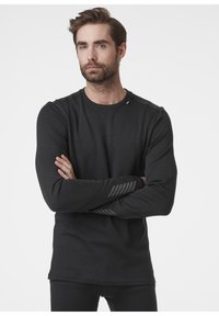 Zwarte longsleeve shirt van zachte stof, met een ronde halslijn en gestreepte accenten op de mouwen. Eenvoudig en aansluitend ontwerp.