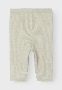 Ribbad baby leggings i mjukt, ljusgrönt tyg. Har elastisk midja och nederkant, med en slät textur och subtilt mönster.