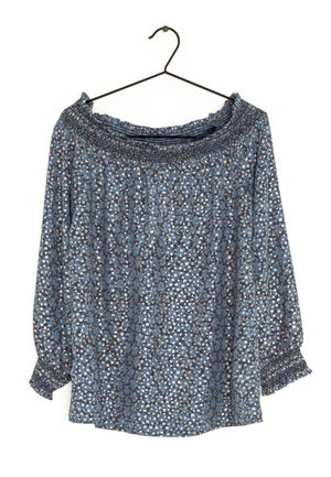 Blue patterned top with an off-the-shoulder neckline, featuring smocked detailing at the cuffs and elastic band around the neckline.