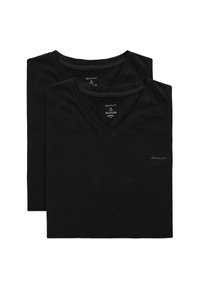 Dos camisetas de algodón negras con cuello en V, con mangas cortas y un logo sutil en el pecho. Textura suave, diseño casual.