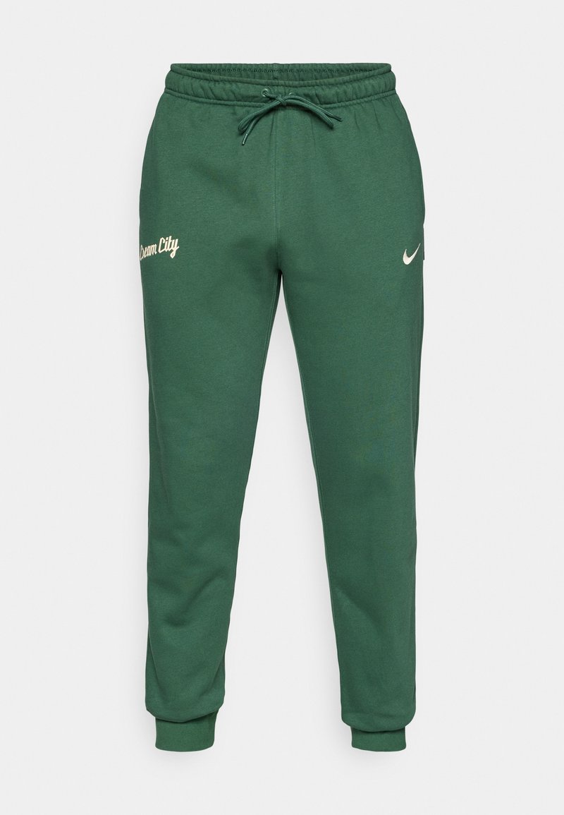 Pantalons de jogging verts en tissu doux, dotés d'une taille avec cordon de serrage, de poignets élastiques, et portant le texte "Dream City" sur la jambe gauche avec un logo Nike.