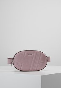 Pink leather oval-shaped bag with quilted pattern, zipper closure, and adjustable strap. Features embossed branding on the front.