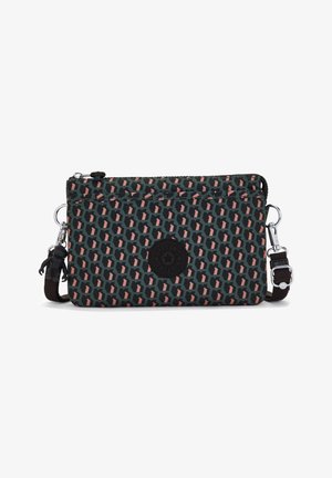 Petit sac bandoulière rectangulaire avec motif géométrique noir, vert et rose, sangle noire ajustable et un porte-clés singe.