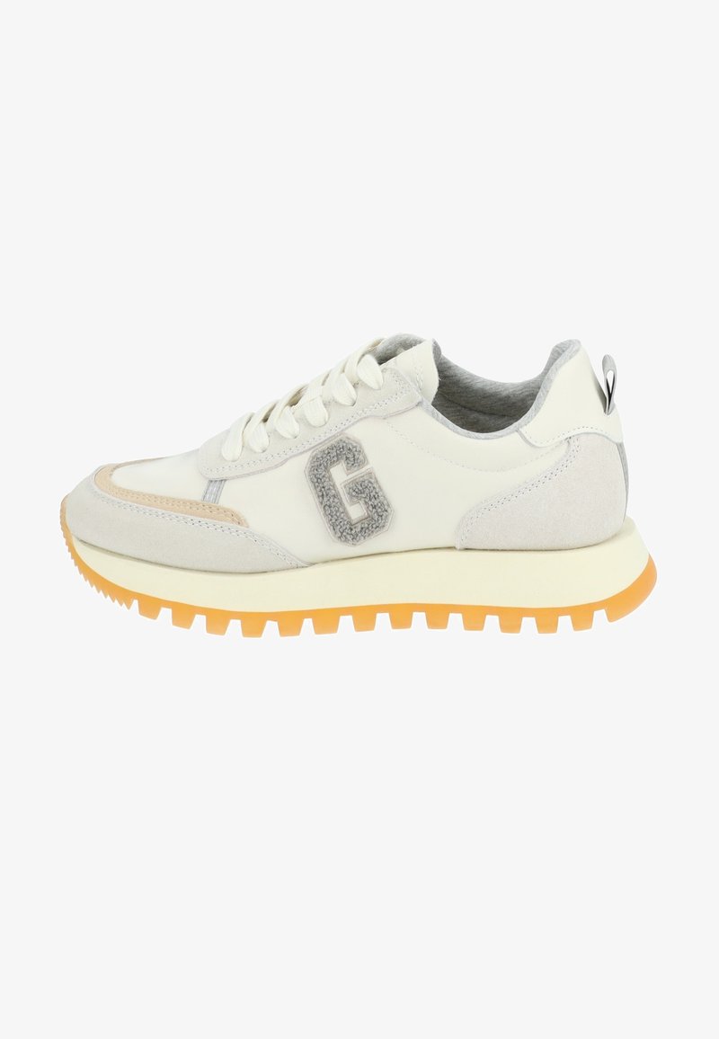 White and grey sneakers with a suede texture, featuring a prominent grey "G" logo, a cushioned sole, and bright orange outsole for traction.