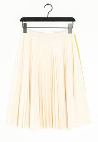 Pleated cream skirt with a wide waistband, featuring a yellow accent on the side. Made of lightweight fabric, hangs from a black hanger.