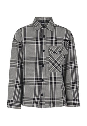 Chaqueta abotonada de cuadros en blanco y negro con cuello puntiagudo y un bolsillo en el pecho con botón en el lado izquierdo.